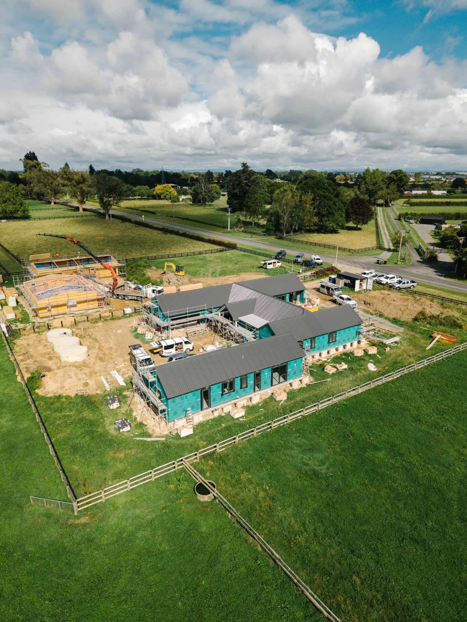 Drone view of a new home under construction on a rural section