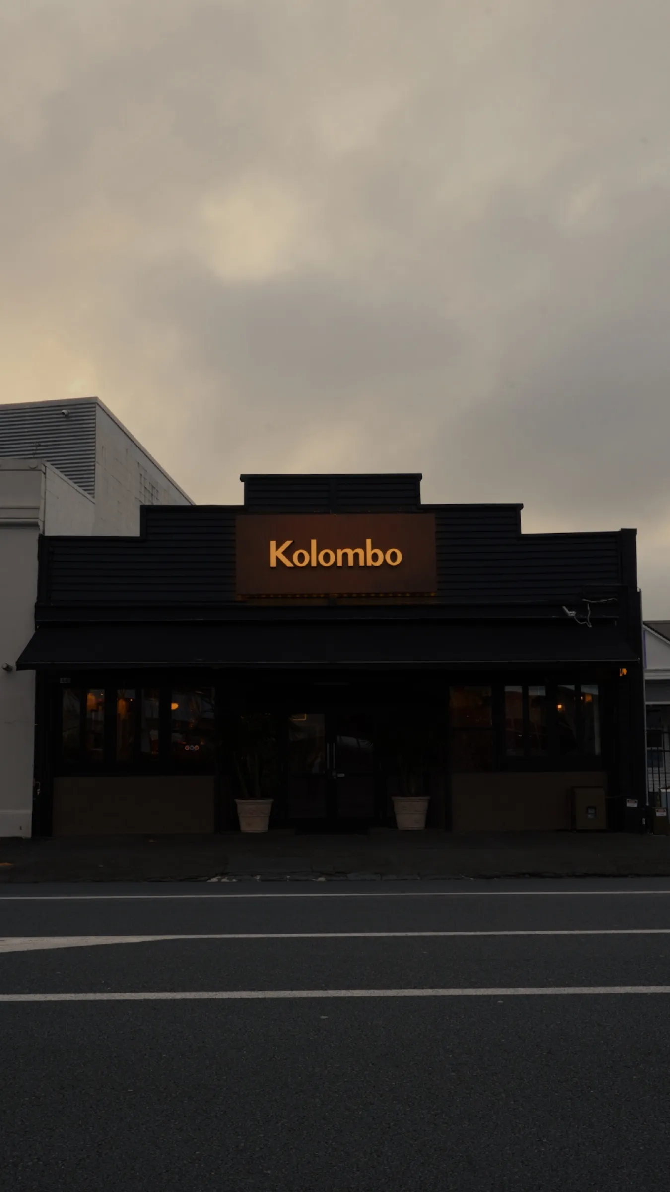 The Kolombo shopfront at dusk