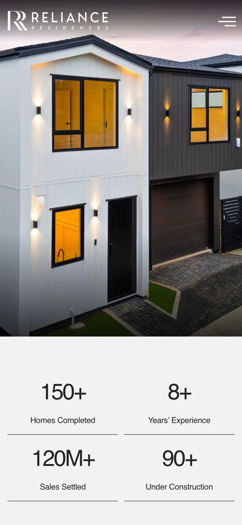 The Reliance Residences homepage on a phone