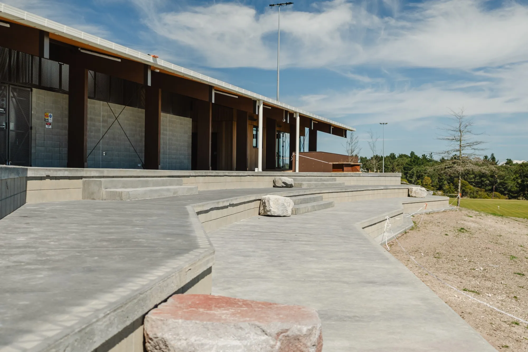 Terraced concrete seating in front of the pavilion